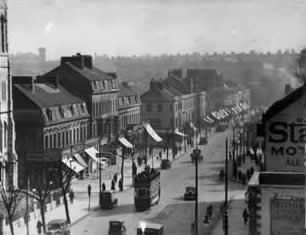 Historic photo of Mutley Pain showing shop awnings
